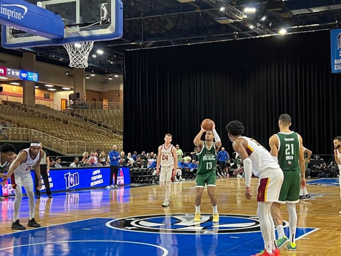 Orlando Magic rookie Jett Howard (13) takes a free throw while two-way NBA veteran Trevelin Queen (13) looks on.